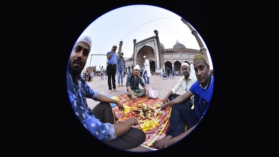 People break their days fast outside the Jama Masjid.The spirit of fasting accommodates acts of charity and kindness to others.