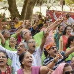 People participate in a laughter club as they celebrate World Laughter Day at the Nana Nani Park in Girgaon Chowpatty.