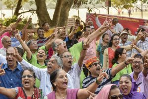 People participate in a laughter club as they celebrate World Laughter Day at the Nana Nani Park in Girgaon Chowpatty.