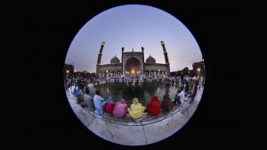 People wash their hands in a pond before their evening prayers outside Jama Masjid, the largest mosque in India.