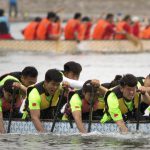 Teams of dragon boat racers paddle their boats during the Dragon Boat festival at the Olympic Water Park in Beijing.