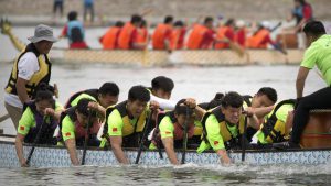 Teams of dragon boat racers paddle their boats during the Dragon Boat festival at the Olympic Water Park in Beijing.