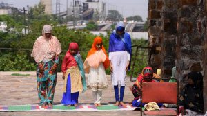 A group of women stand in file during Juma-tul-Wida prayers at the Firoz Shah Kotla mosque on June 23, 2017 in New Delhi