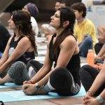A group session on Yoga Day at Cyberhub in Gurgaon, Haryana