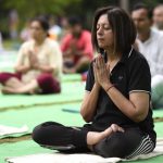 A large group performs yoga at Lodhi Garden in New Delhi on June 18, 2017.