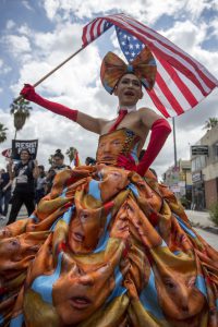 A participant wears a dress he made covered with faces of President Donald Trump at the #ResistMarch during the 47th annual LA Pride Festival on June 11, 2017, in the Hollywood section of Los Angeles and West Hollywood, California. Inspired by the huge women’s marches that took place around the world following the inauguration of President Donald Trump and by the early pride demonstrations of the 1970s, LA Pride replaced its decades-old parade with the #ResistMarch protest to promote human rights by marching from Hollywood to West Hollywood.