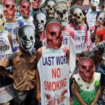 Children wear mask during an awareness campaign on 'World No Tobacco Day' in Kolkata on Wednesday.