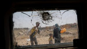 Displaced Iraqis flee during a fight between Iraqi Counter Terrorism Service (CTS) forces and Islamic State militants in western Mosul, Iraq, May 15, 2017.