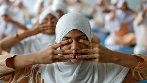 Girls attend a yoga lesson at a school ahead of International Yoga Day in Ahmedabad, Gujarat on June 15, 2017.