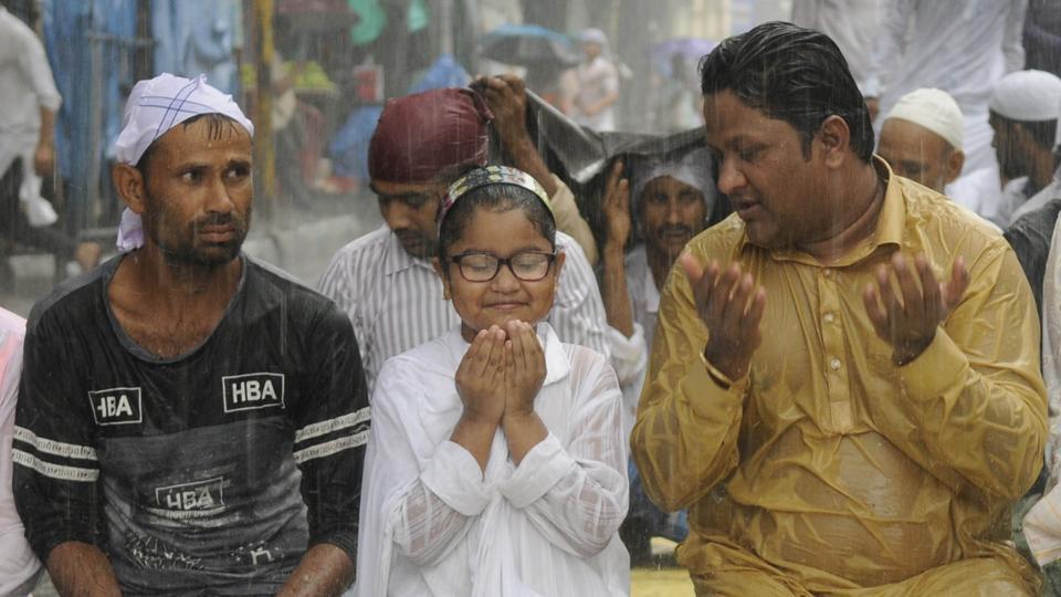 Heavy rain met people out for the last Friday prayers of Ramadan in front of Tipu Sultan Mosque in Kolkata, West Bengal.