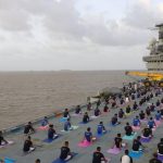 Indian Naval Cadets perform yoga on the deck of INS Virat on International Yoga Day in Mumbai, Maharashtra. Large scale yoga sessions have people across India bending and twisting into various poses on International Day of Yoga.