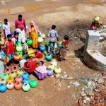 People gather around a well in a drought-hit in Lakya near Chikmagalur, Karnataka.