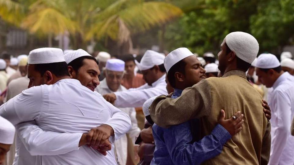People greet each other after the morning prayers