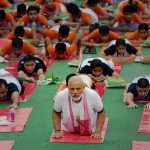 Prime Minister Narendra Modi performs yoga during a mass yoga event on 3rd International Yoga Day in Lucknow on Wednesday.
