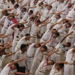Students perform yoga on the occasion of International Yoga Day at Mira Road in Mumbai, Maharashtra