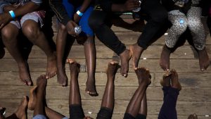 Women on their way to Italy sit on the deck of the rescue vessel Golfo Azzurro, after being rescued by Spanish NGO Proactiva Open Arms workers from the Mediterranean Sea on Friday, June. 16, 2017.