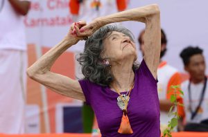 Yoga master Tao Porchon-Lynch, 98, takes part in a mass yoga session on International Yoga Day at the Shree Kanteerava Stadium in Bangalore on June 21.