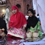 Young girls with family at the Jama Masjid complex having completed their first fast, on the eve of Juma-tul-Wida, on June 22, 2017 in Delhi