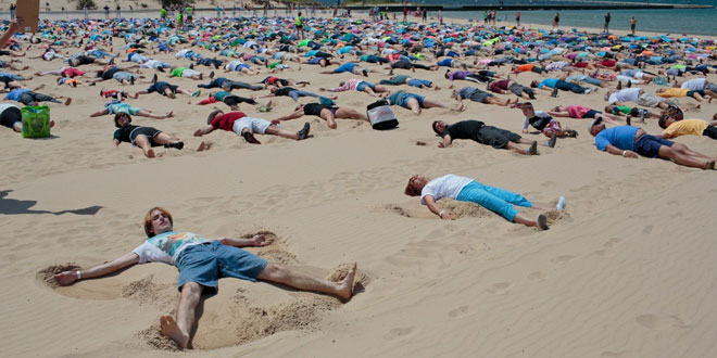 Most people making sand angels simultaneously