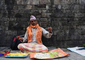 A Nepalese Hindu priest prepares ‘janai’ (sacred thread) as he waits for devotees on the occasion of the Janai Purnima Festival in Kathmandu