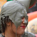 A woman is covered with mud during the 20th Boryeong Mud Festival at Daecheon beach in Boryeong.
