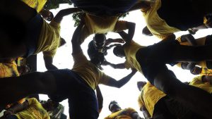 Mandal members huddle together for the last time before the event.