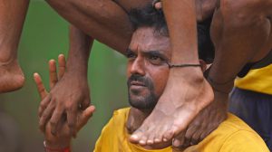 Members test their strength during a practice session.