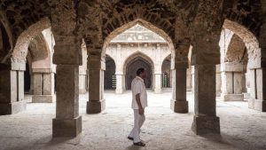 The Khirki Masjid was commissioned in the 1350s by Khan-i-Jahan Junan Shah, the Vazir or Prime Minister of Feroz Shah Tughlaq. The mosque derives its name from the rows of windows that surround the upper floor of this quadrangular structure built on a raised platform.