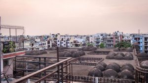 The site’s claimed dual-purpose is reflected in a number of architectural decisions that make the Khirki mosque stand apart. It is one of North India’s most unique mosques with a courtyard that is mostly covered and a roof embellished with 81 small domes instead of a large central structure. In place of minarets the mosque is flanked by tapering towers topped with turrets on all four sides as well as the entrances.