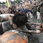 Women wrestle in a mud pool during the Boryeong Mud Festival.