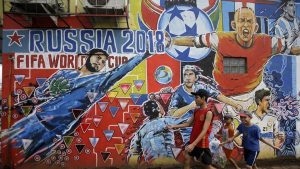 A mural of footballers in action to advertise the upcoming the FIFA World Cup 2018 on the outskirts of Jakarta, Indonesia