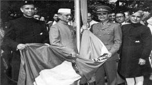In the presence of Washington diplomats and high ranking US Army and Navy officers, Ambassador Asaf Ali hoists the Indian flag at the Indian embassy in ceremonies marking the country's independence from British rule.