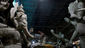 Artist Krunal Patil amid his work.