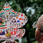 Kite-maker Jagmohan Kanojia shows a kite with photos of football players and teams participating in FIFA World Cup 2018 in Amritsar