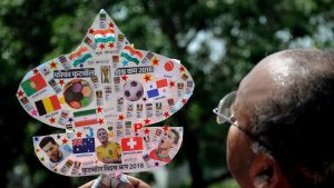 Kite-maker Jagmohan Kanojia shows a kite with photos of football players and teams participating in FIFA World Cup 2018 in Amritsar