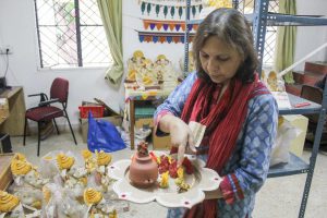 Lolita Gupta, co-founder of eCoexist Enterprises, showcases ecofriendly decor for Ganesh festival.