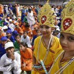 School children dressed as Lord Krishna take part in the full dress rehearsal ahead at the Red Fort.