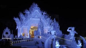 At the Deshapriya Park Durga Puja in South Kolkata, India, the theme is Thailand’s ‘White Palace.’ The Deshapriya Park committee has recreated the 20th century Wat Rong Khun temple also known as White Temple, located just outside Chiang Rai in northern Thailand. The detailed all-white exterior with mirror trimmings stands out in stark contrast against the grassy park lawns.