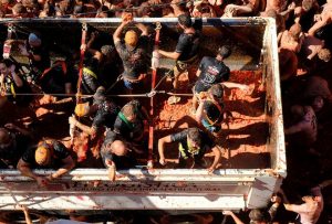 Revellers throw tomatoes during the annual ‘La Tomatina’ food fight festival in Bunol, near Valencia, Spain on August 28, 2019.