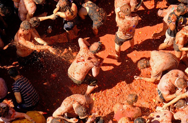 Revellers throw tomatoes during the annual ‘La Tomatina’ food fight festival in Bunol, near Valencia, Spain on August 28, 2019.