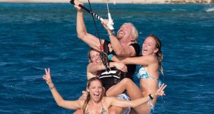 Most people riding a kitesurf board