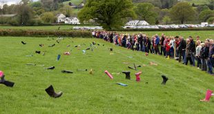 Most people throwing Wellington boots