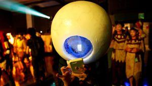 A participant in costume uses a mobile phone at a Halloween event in Kawasaki, Japan.