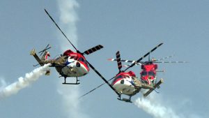 Indian Air Force’s ‘Sarang’ Helicopter Aerobatic team displaying maneuvers during the 85th Air Force Day parade at Hindon Air Force base in Ghaziabad.