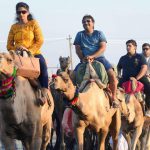 Tourists enjoy a camel ride during the International Camel Fair in Rajasthan. The peak celebrations generally occur in the last five days with the festival ending on Kartik Poornima, the full moon day of Kartik in Hindu calendar.