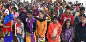 Devotees pray on the occasion of Christmas at a church in Sector 19 in Chandigarh on December 25, 2017