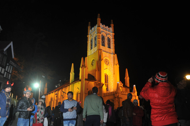 Tourists gathered near the Christ Church during Christmas celebrations in Shimla on December 25, 2017