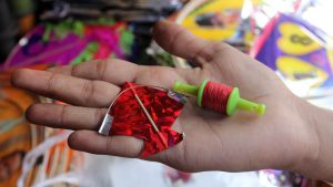 A miniature kite and manjha set at a shop in Jambali Naka, Thane.