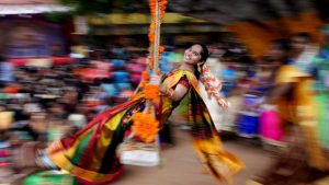 A student seen on a swing during celebrations for Pongal, the Tamil harvest festival, at a college in Chennai.