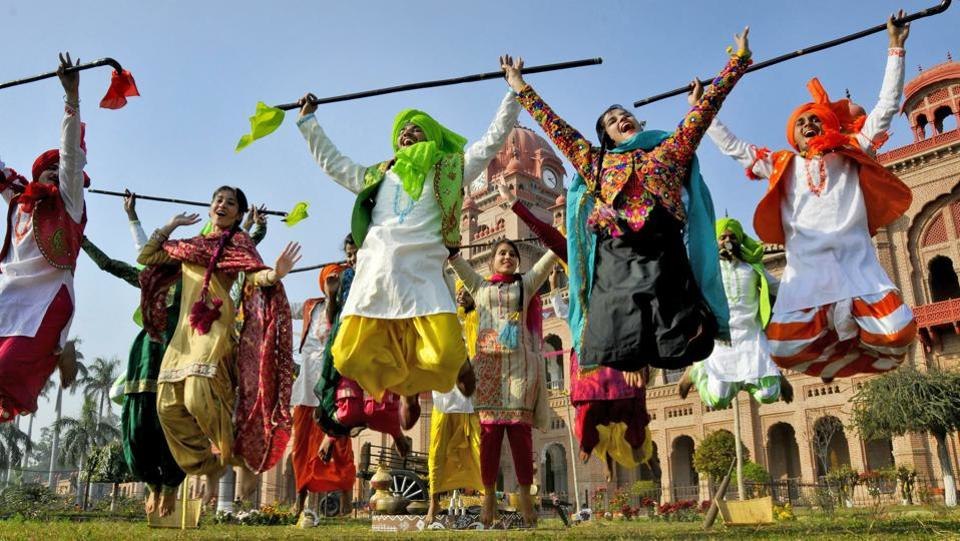 Students wearing traditional Punjabi attire dance during the Lohri festival celebrations in Amritsar. Lohri is celebrated on the last day of ‘Poh’ month of the Bikrami calendar, a day before the month of ‘Maagh’ begins.